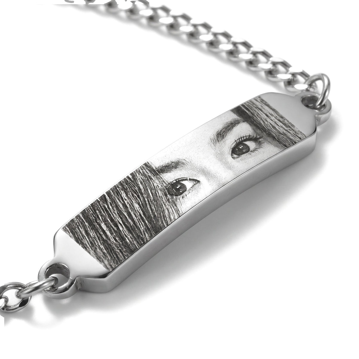 Close-up of the eye engraving on the silver bracelet bar